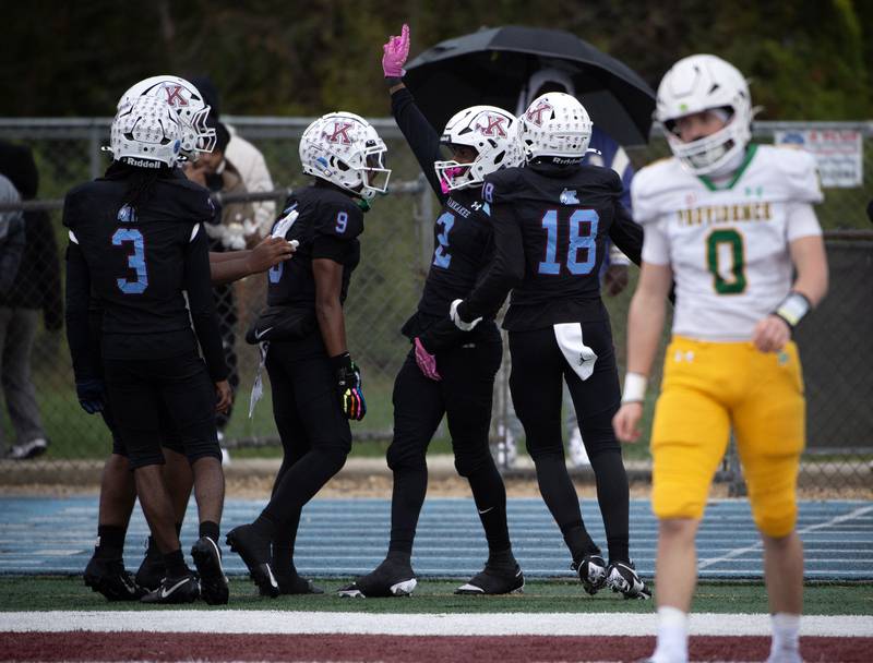 Kankakee's Ezekiel Sherrod, center right, celebrates a touchdown in the first half with teammates in a Class 5A playoff against Providence Catholic on Saturday, November 8, 2025.
