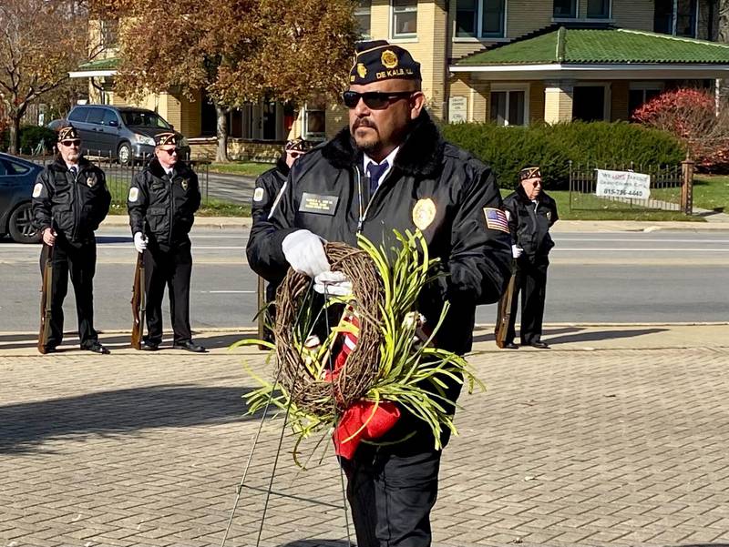 DeKalb American Legion Post No. 66 Cmdr Manual Olada, a U.S. Marines veteran, laid a ceremonial wreath at the Soldiers' and Sailors' Memorial Clock during an annual Veterans Day ceremony Saturday, Nov. 11, 2023 in downtown DeKalb. The event was hosted by the DeKalb American Legion Post No. 66.