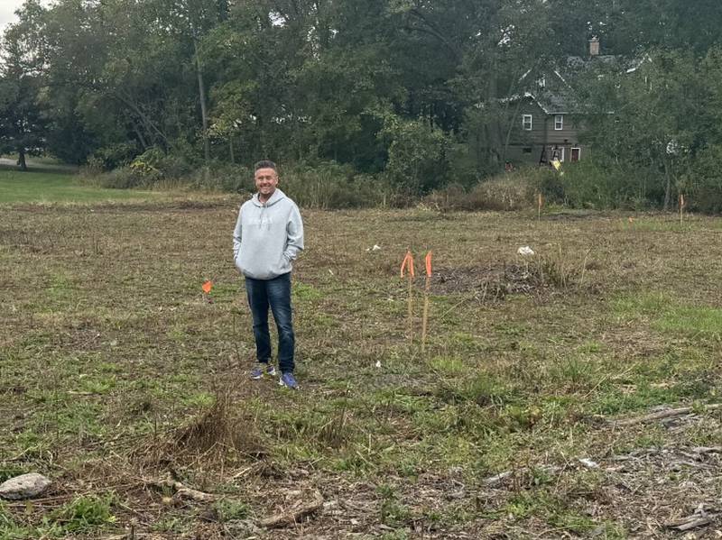 Dan Woodward of New Directions Addiction Recovery Services shows the property where the organization plans to build "three-quarter" sober living apartments in Woodstock.