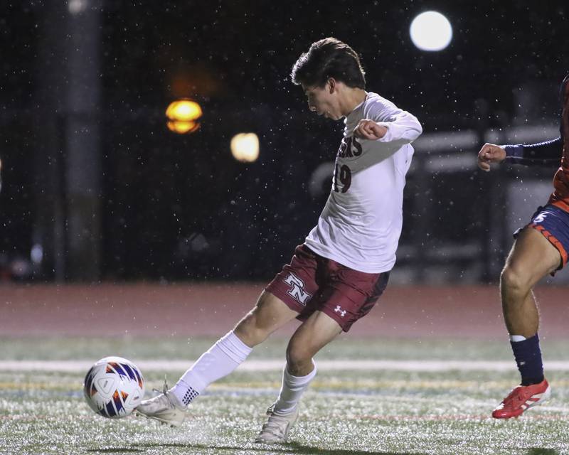 Plainfield North's Sebastian Gonzalez (19) kicks on goal to tie up the game in the first half during Class 3A Naperville Central Regional semifinal soccer match between Plainfield North at Oswego, Tuesday Oct 21, 2025.