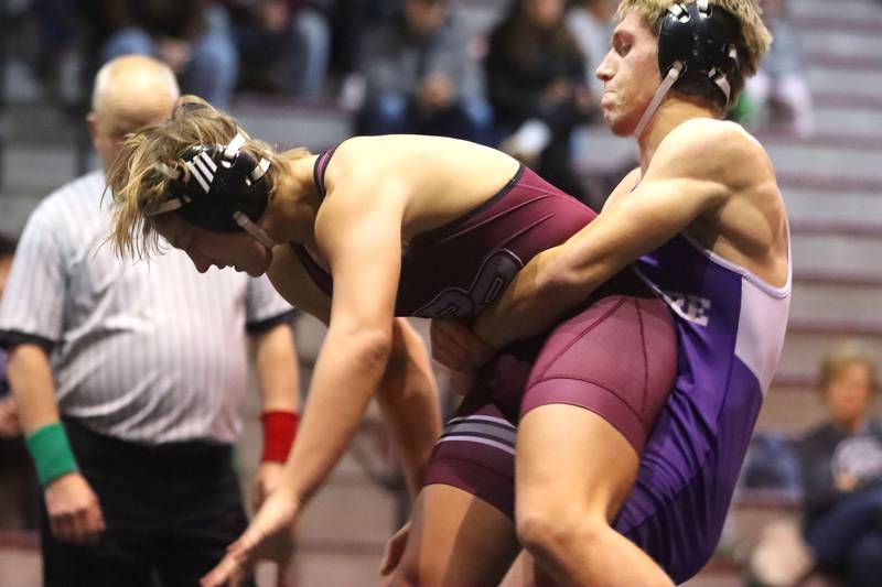 Prairie Ridge’s Jacob Meade, left, battles Hampshire’s Jasper Hintz at 165 pounds in varsity boys wrestling on Thursday, Dec. 4, 2025, at  Prairie Ridge High School in Crystal Lake.