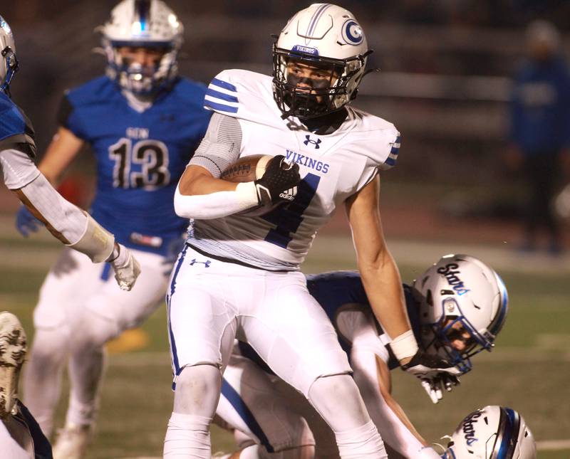 Geneva’s Troy Velez runs the ball during a game against St. Charles North in St. Charles on Friday, Oct. 20, 2023.