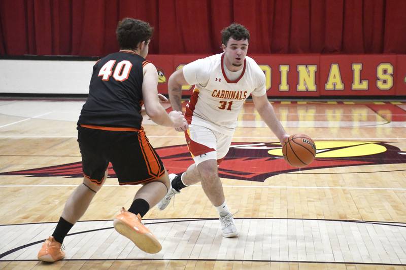 St. Anne's Brandon Schoth looks to attack while guarded by Gardner-South Wilmington's Holden Grimes during St. Anne's 52-45 victory over Gardner-South Wilmington on Tuesday, January 13, 2026.