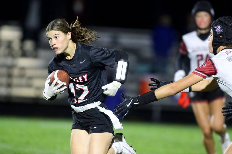 Huntley’s Aubrina Adamik runs the ball against Antioch in IHSA Regional varsity flag football action at Crystal Lake Central High School in Crystal Lake on Wednesday, Oct. 8, 2025.