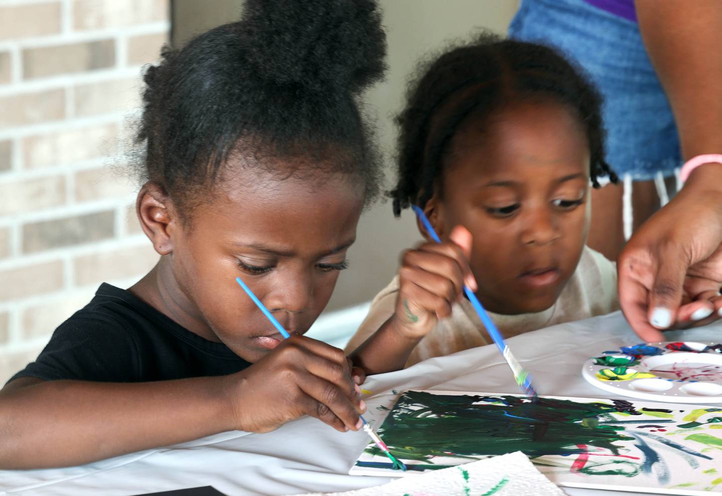 Jayden, (left) and Aiden Morgan, 4, from DeKalb work on their paintings during Fun Jam in the Park Tuesday, June 27, 2023, at Welsh Park in DeKalb. Fun Jam in the Park offers constructive activities for kids on Tuesday and Thursday through August 8th from 5-7 p.m. at various parks in DeKalb.