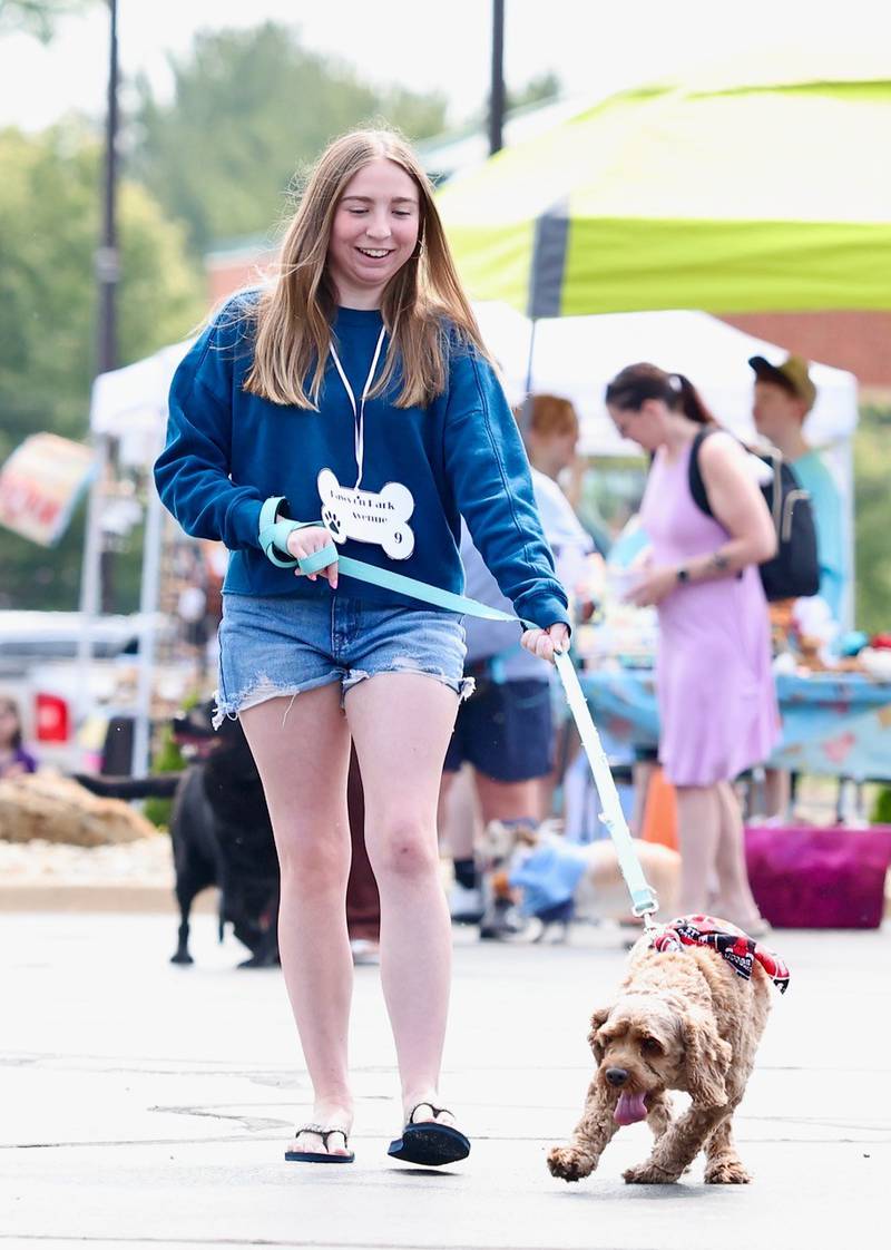 Emma Mivity and Sparky entertain the Residents of Greenfield Retirement Home in Princeton during the Paws on Park Avenue parade on Saturday, May 31.