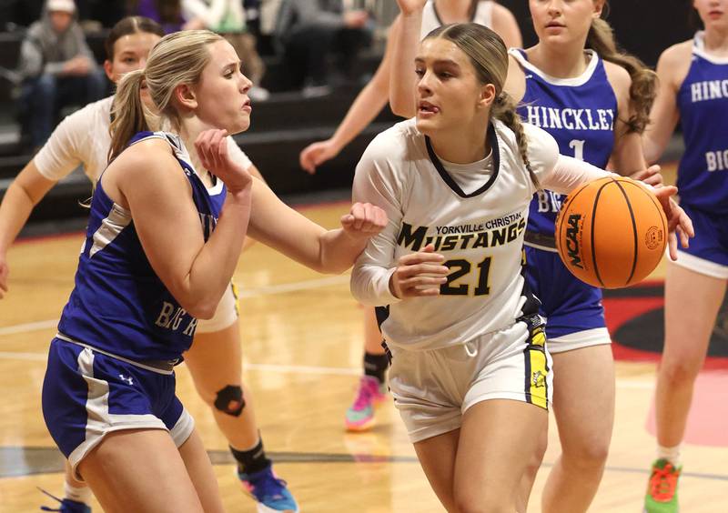 Yorkville Christian's Danielle Bulson drives against Hinckley-Big Rock's Anna Hermann during their Class 1A regional game Tuesday, Feb. 17, 2025, at Indian Creek High School in Shabbona.