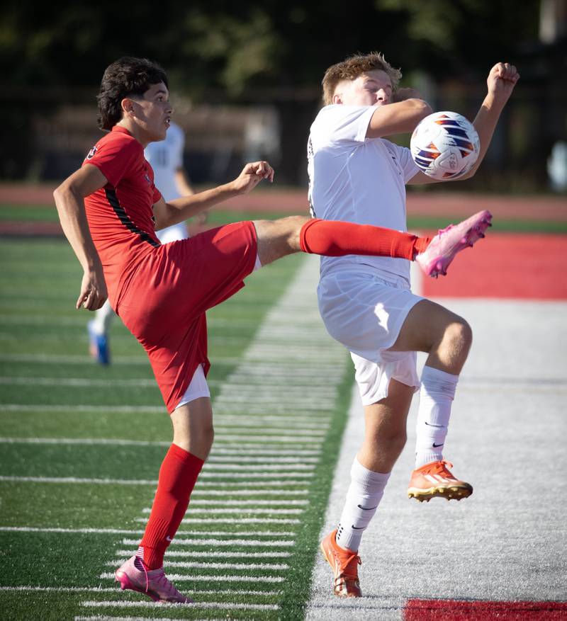 Bradley-Bourbonnais' Antony Martinez, left, plays the ball as Minooka's Aidan Gubbins reacts in a game on Tuesday, August 26, 2025.