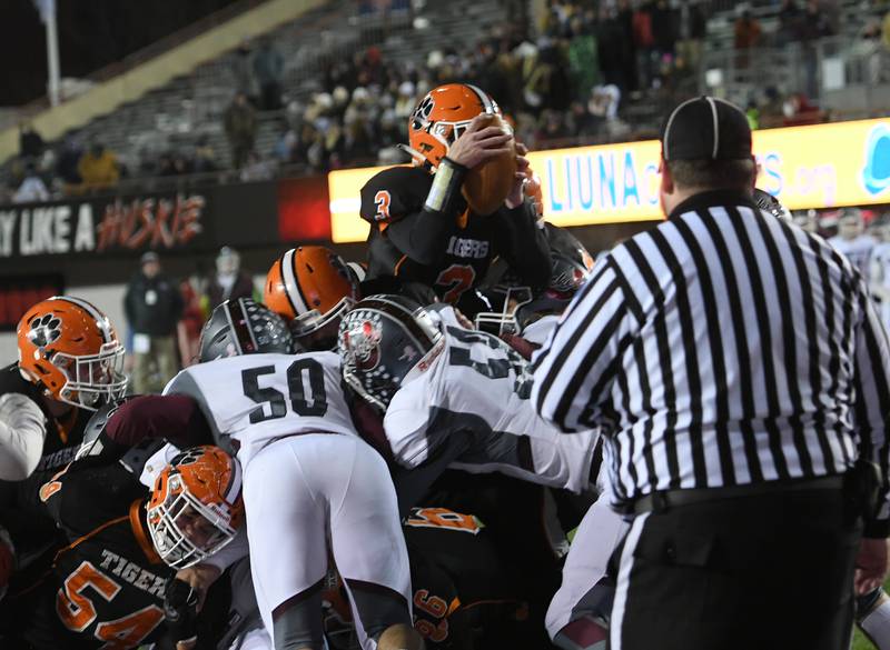 Byron's Braden Smith jumps into the air for a touchdown during the 3A championship game against Tolono Unity at NIU's Huskie Stadium on Friday. Byron won the game 35-7