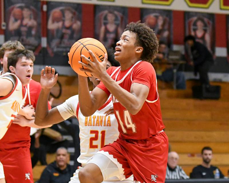 Hinsdale Central's Dominic Walker (14) goes up for a shot during the game on Saturday Jan. 24, 2026,while traveling to take on Batavia High School.
