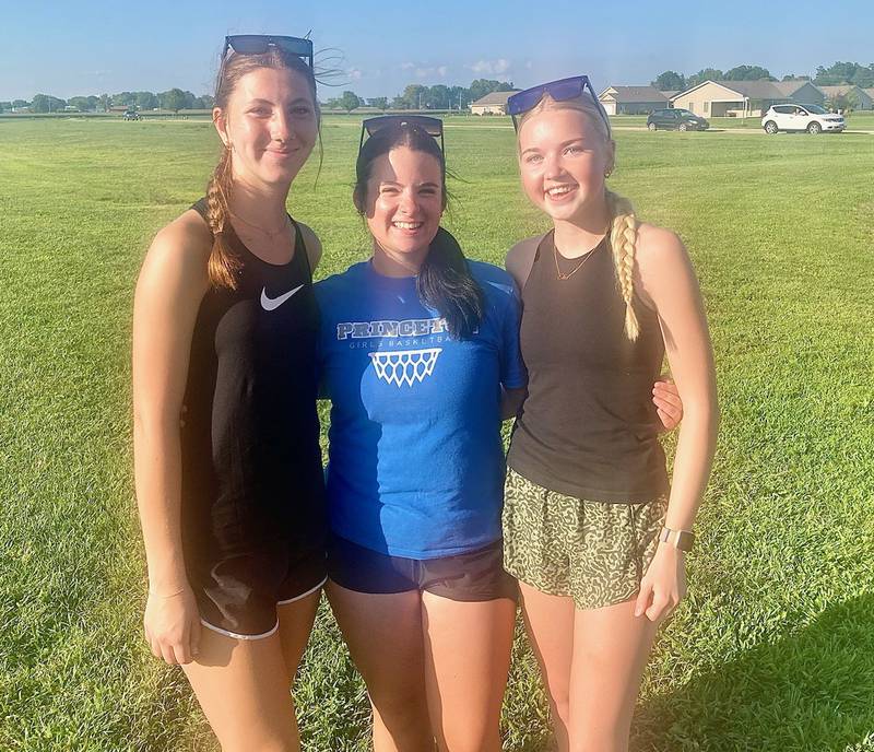 The Princeton football team has Addison Dever (from left), Riley Rauh and Paityn Lucas looking after them this year as team managers. The Tigers did not have managers last year.