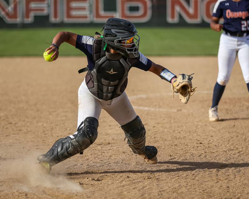 Oswego's Kiyah Chavez (10) throws to first after fielding a bunt during Class 4A Plainfield North Sectional final softball game between Wheaton North at Oswego. May 31th, 2024.