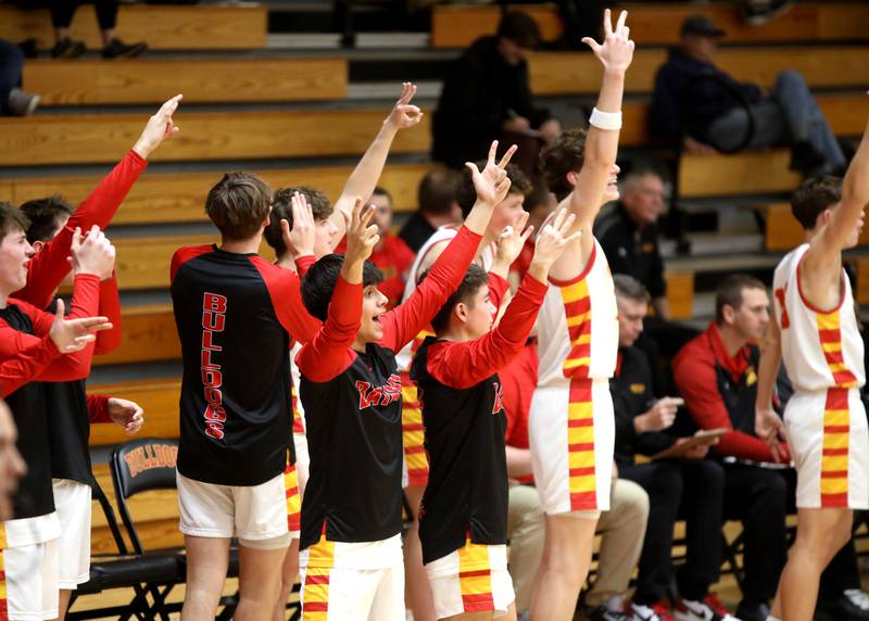 Batavia’s bench erupts after a three-pointer during a game against St. Charles North on Wednesday, Dec. 11, 2024 in Batavia.