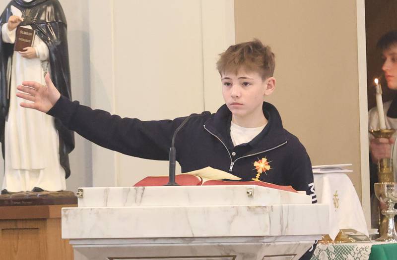 Dax Manicki, a student at Academy of St. Carlo Acutis, reads the Responsorial Psalm during the first ever all-school Mass on Friday, Jan. 30, 2026 at St. Joseph’s Catholic Church in Peru.