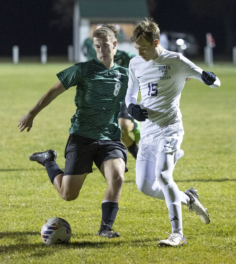 Dixon’s Logan Grett and Geneseo’s Eric States go after a ball Wednesday, Oct. 23, 2024, during the class 2A soccer regional in Geneseo.