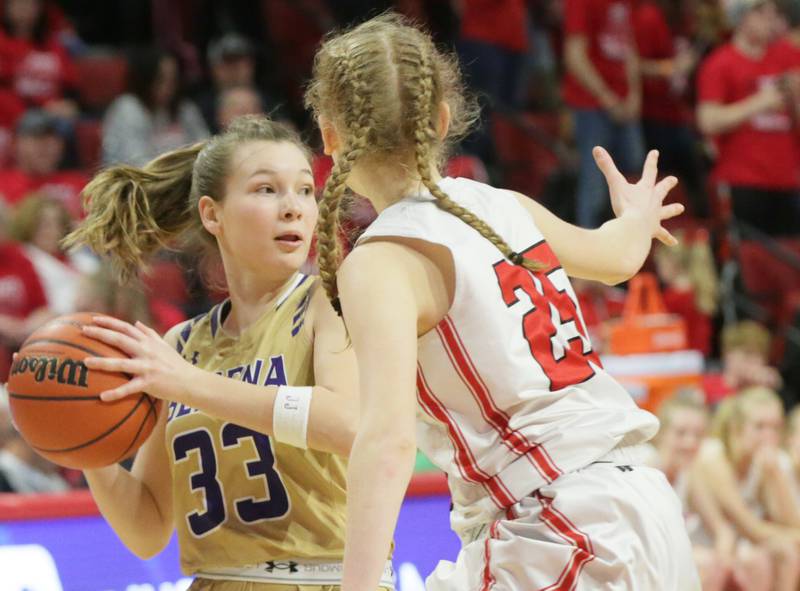 Serena's Jenna Setchell (33) looks for a teammate as Neoga's Sydney Richards (25) defends in the Class 1A girls basketball third-place game on Thursday, March 3, 2022, at Redbird Arena in Normal.