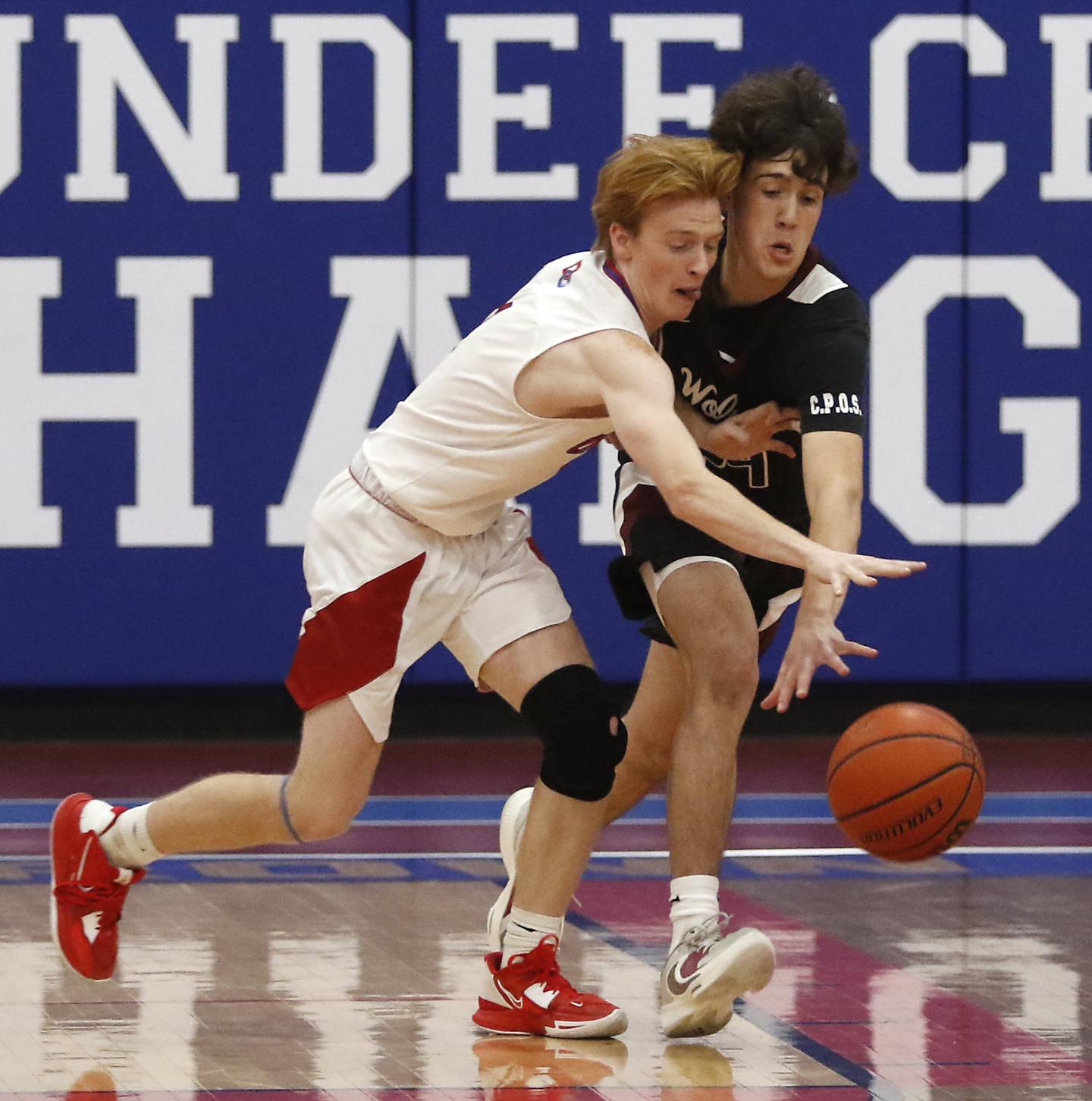 Dundee-Crown's Zach Randl battles with Prairie Ridge's Ben Gablenz for a loose ball during a Fox Valley Conference basketball game Wednesday, Dec. 14, 2022, between Dundee-Crown and Prairie Ridge at Dundee-Crown High School in Carpentersville.