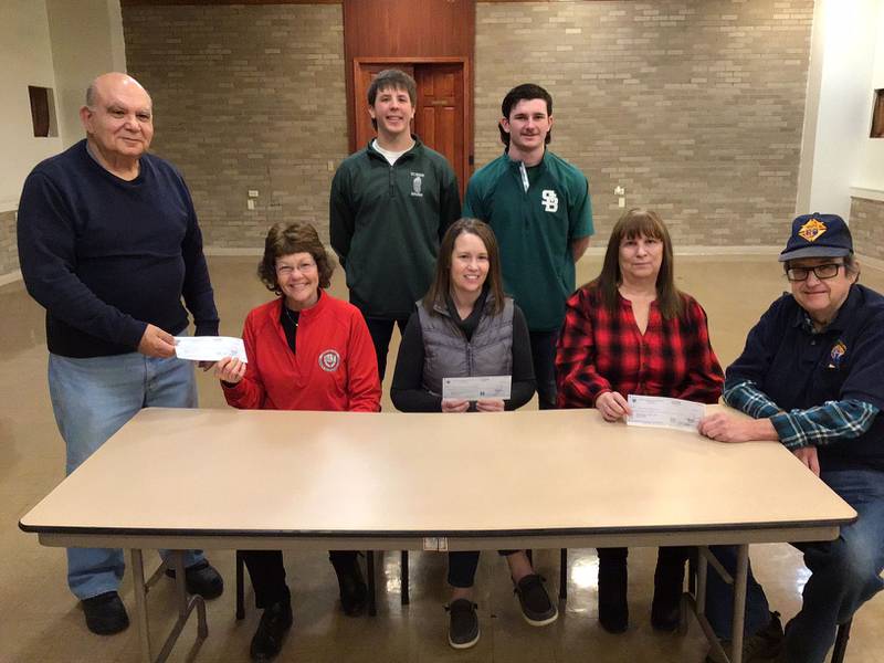 The Utica Father Marquette Council of the Knights of Columbus recently presented checks totaling over $2,100 to Lighted Way, Starved Rock Regional Center for Therapy and Child Development, Horizon House and the Special Olympics. Money was raised through the annual Tootsie Roll drive. Gathered at the check presentation were (from left Jim Polizzi, Grand Knight; Jessica Kreiser Lighted Way executive director; Logan Potthoff, St. Bede; Paula Williamson director Starved Rock Regional Center for Therapy and Child Development; Seth Ferrari St. Bede; Alice Buczkowski Horizon House; Mike Brown KC Trustee. A representative of Special Olympics was not able to attend.Members of the St. Bede athletic teams and student body have assisted the KC’s yearly in the collection process.