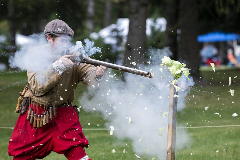 Elizabethan history educator Andy Montano blasts apart a head of cabbage Saturday, Sept. 21, 2024, during a demonstration of early rifle technology at Fall and Fantasy Fest. The group could not shoot live ammo but still wanted to show the power of early armaments.