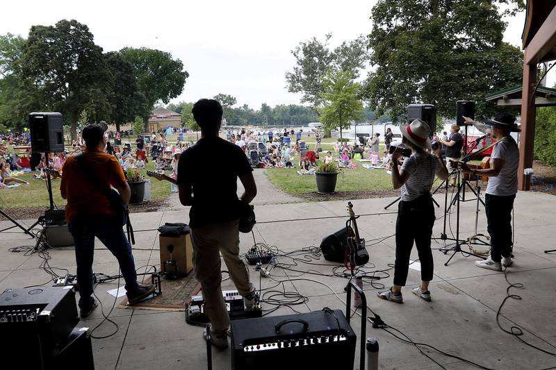 Member of the Being Bilingual Rocks (BBR) Band perform during the Crystal Lake Park District and Public Library's Summer Singalong for Kids on Friday, June 21, 2024, at Crystal Lake's Main Beach.
