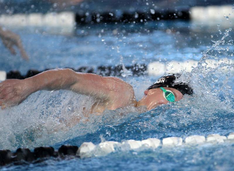 Cary-Grove’s Drew Watson swims in the consolation heat of the 400-yard freestyle relay during the IHSA Boys Swimming and Diving Championships at FMC Natatorium in Westmont on Saturday, Feb. 26. 2022.