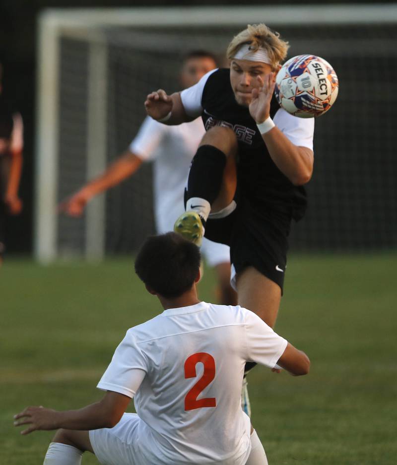 Prairie Ridge's Gabriel Porter kicks the ball away from Crystal Lake Central's Joshua Hernandez during a Fox Valley Conference soccer match on Thursday, Oct. 10, 2024, at Prairie Ridge High School.