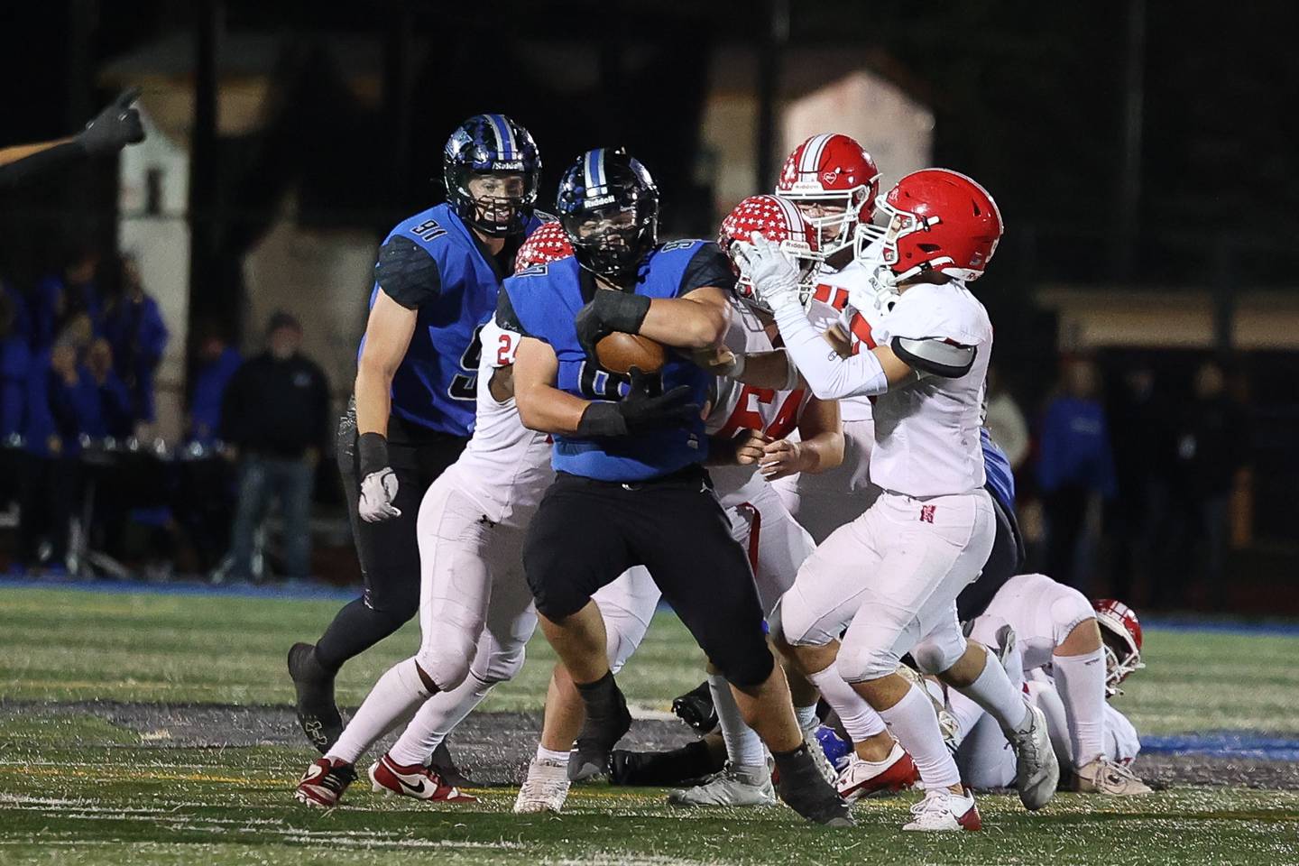 Lincoln-Way East’s Gage LaDere pulls in an interception which he returned for a touchdown against Naperville Central on Friday, Oct. 25, 2024 in Frankfort.