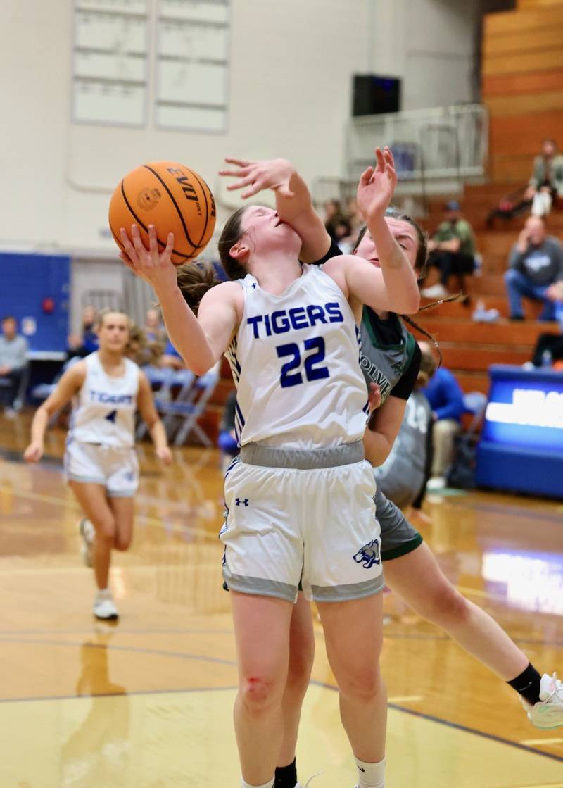 Princeton's Camryn Driscoll gets a helping hand against Midland Thursday night at Prouty Gym. The Tigresses won 69-34 to improve to 3-0 and advance to Saturday's championship game.