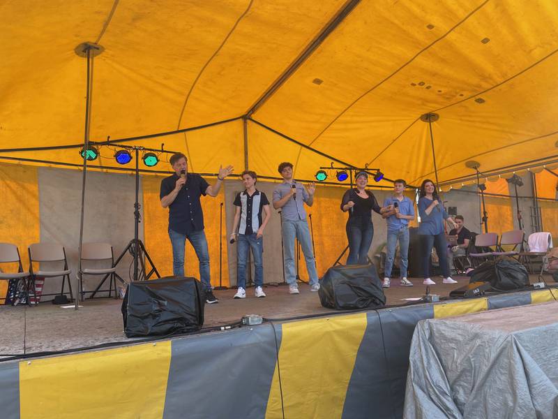 Oglesby native Ron Sharpe (far left) and the Sharpe Family Singers wave to the crowd Sunday, June 16, 2024, during Oglesby Summer Fun Fest.