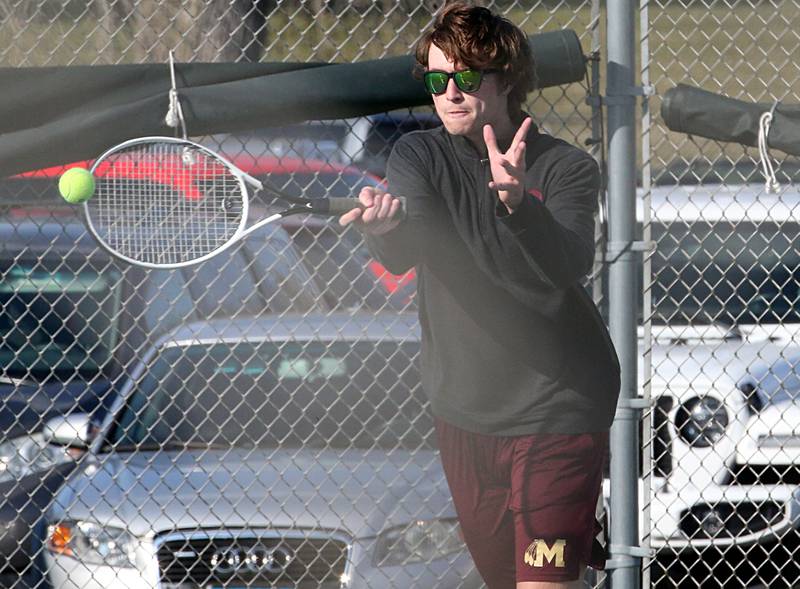 Morris's Conor Ahem plays tennis against Ottawa on Tuesday, March 28, 2023 at Ottawa High School.