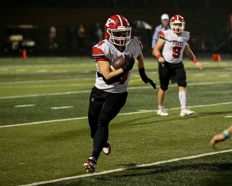 Yorkville's Josh Gettemy (4) runs with the ball during Class 7A football playoff game between Yorkville at Willowbrook.   Oct 27, 2023.