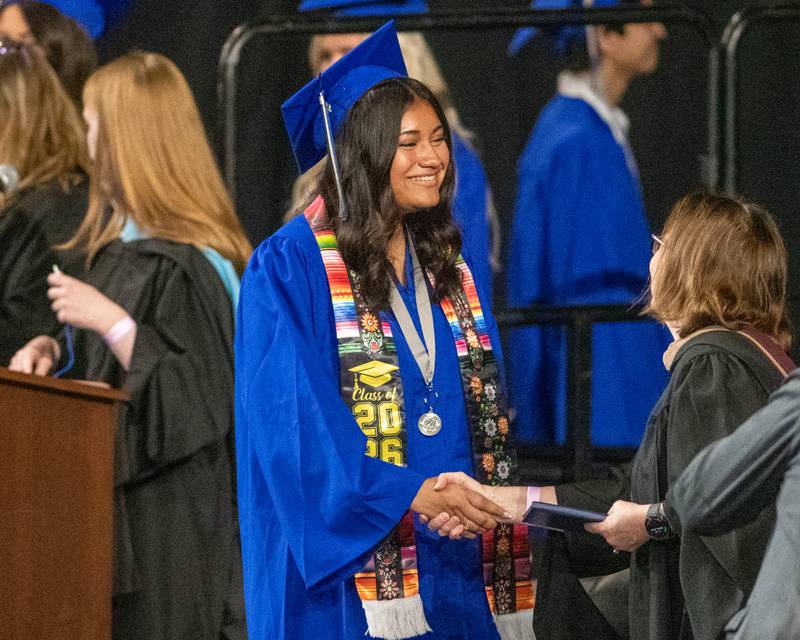 A St. Charles North graduate accepts her diploma on Monday May 18, 2026, held at the Convocation Center in DeKalb.