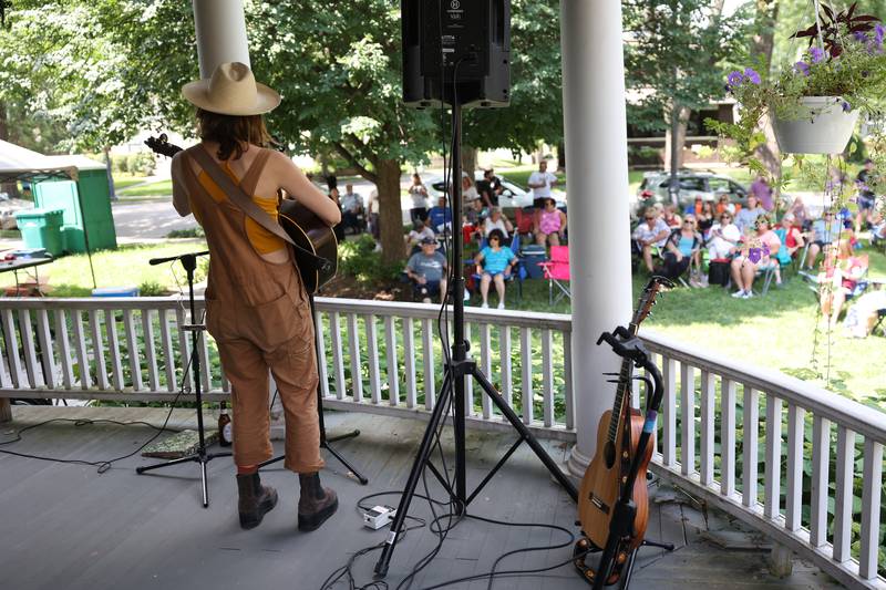 Laney Jones performs on a porch along Western Avenue. The Upper Bluff Historic District hosted Porch & Park Music Fest featuring a variety of musical artist at five different locations. Saturday, July 30, 2022 in Joliet.
