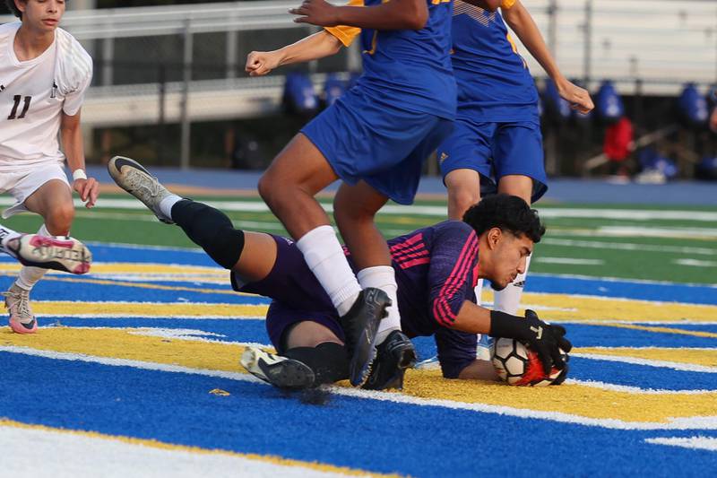 Joliet Central’s Chris Torres makes a save against Joliet Catholic on Monday, Sept. 9, 2024 in Joliet.
