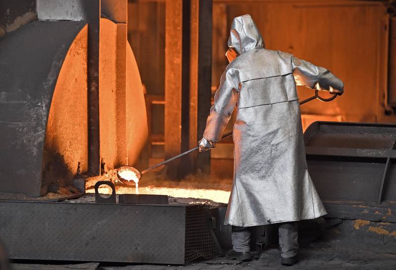 FILE - A handles molten metal at the Thyssenkrupp steel factory in Duisburg, Germany, April 27, 2018. (AP Photo/Martin Meissner, File)