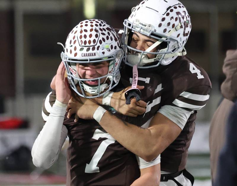Mount Carmel's Emmett Dowling (left) and Quentin Burrell celebrate Wednesday, Dec. 3, 2025, after their win over Oswego in the IHSA Class 8A state chamionship game in Huskie Stadium at Northern Illinois University in DeKalb.