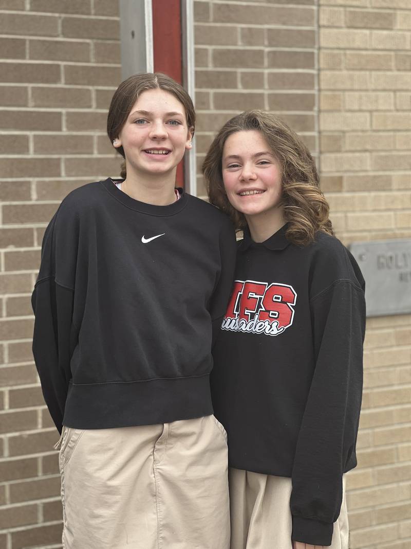 Runner-up Aubrey Duttlinger (left) and first place winner Clara Weitl pose after being named winners of the Oglesby American Legion Auxiliary Americanism essay contest.