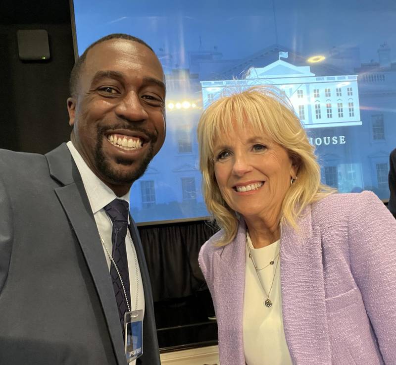 Marcus Belin (left) poses with First Lady Jill Biden (right). Belin was invited to Washington D.C. after being recognized by the NASSP as one of the nation's three 2021 digital principals of the year.