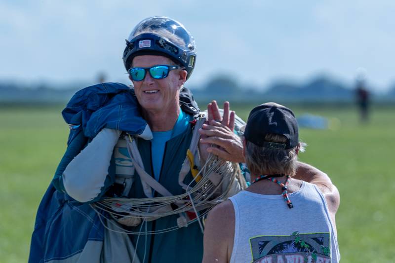 Todd Self walks back from drop zone on Friday, Aug 22, 2025 above Skydive Chicago in Ottawa.