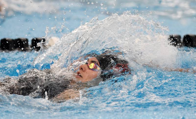 Hinsdale Central’s Caroline Kramer swims backstroke in the consolation final of the 200-yard individual medley during the IHSA girls state swimming finals at FMC Natatorium in Westmont on Saturday, Nov. 12, 2022.