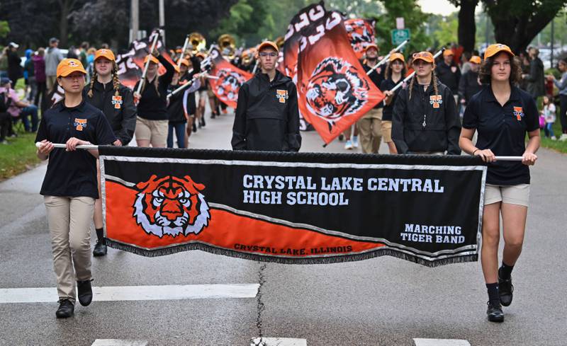 Crystal Lake Central High School's Eileen Wei (Left) and Audrey Kanellopoulos lead the school's Marching Tiger Band to begin the start of the school's 100 year anniversary homecoming day parade on Saturday, Sep. 16, 2023 in Crystal Lake. The parade began at the high school and made its way through downtown Crystal Lake.