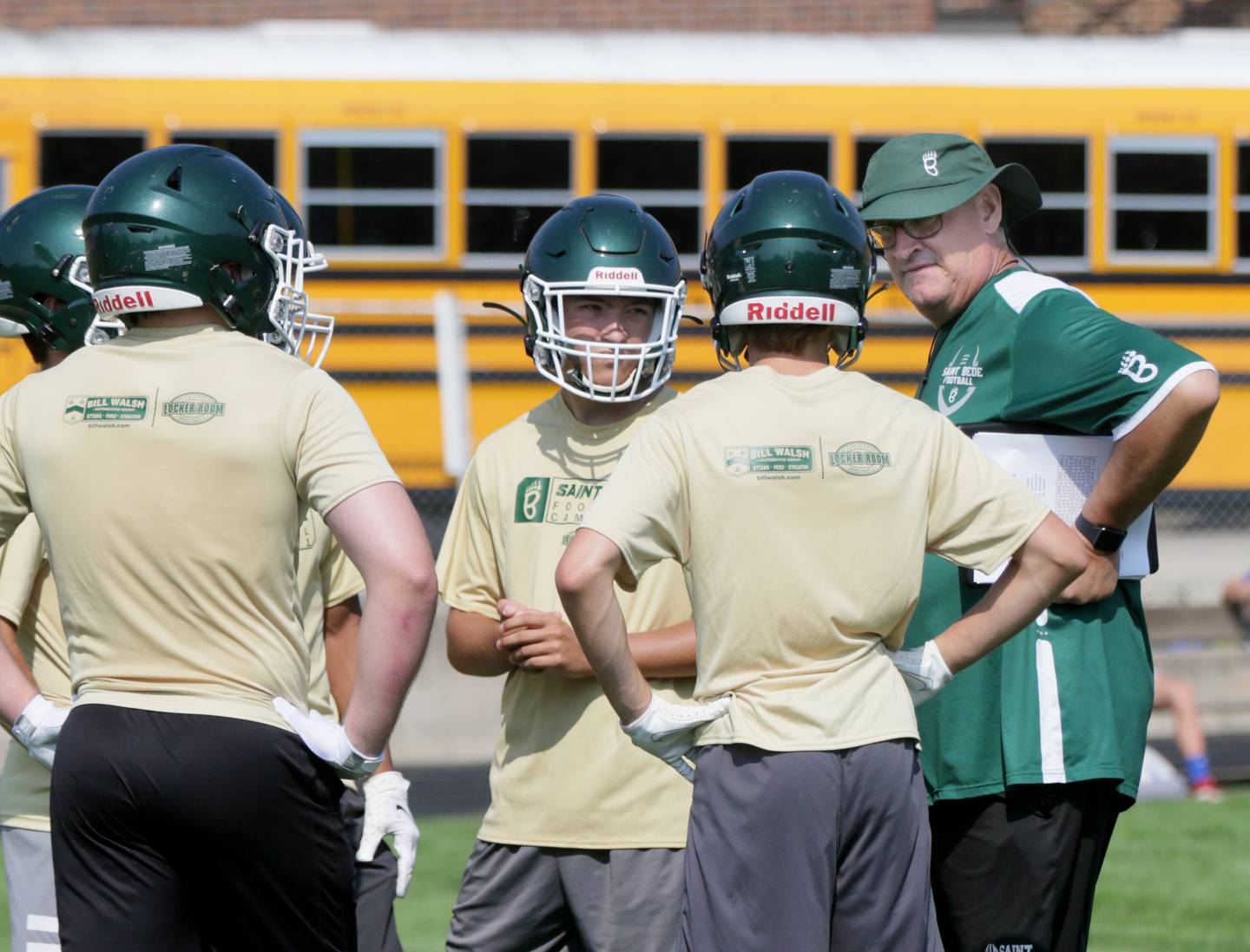 St. Bede head coach Jim Eustice, (right) talks to his players before playing Morrison at the Princeton 7 on 7 event at Princeton High School on Saturday July 17, 2021.