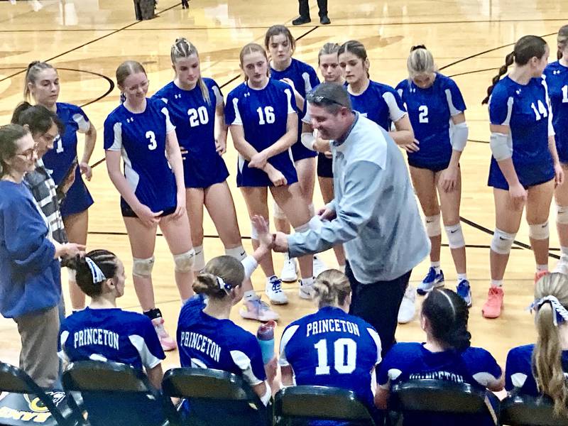 Princeton coach Andy Puck high fives the bench after the Tigresses' Game 1 win in Tuesday's sectional semifinal match at Riverdale. Peoria Notre Dame rallied to win in three sets.