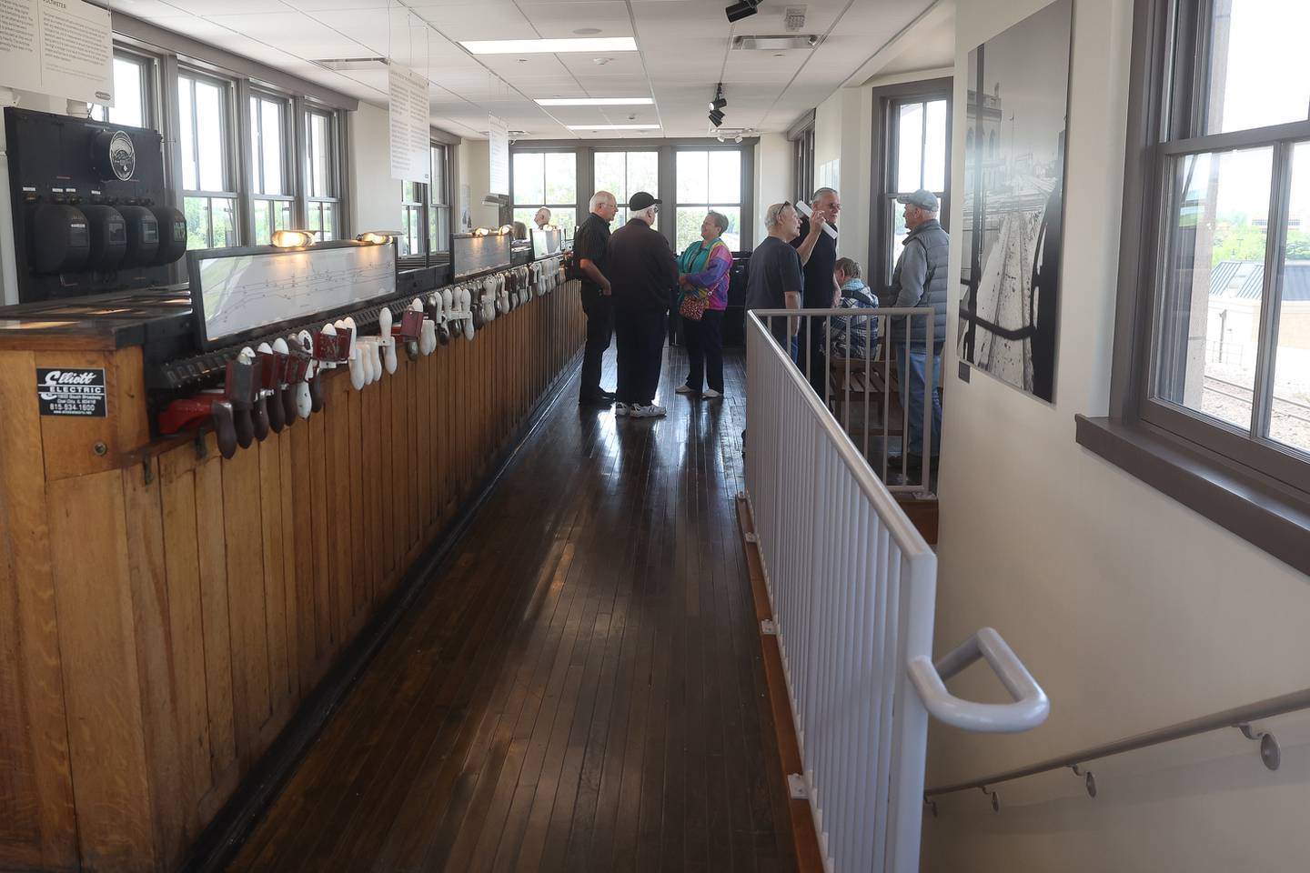 A group of former railroad workers and railroad enthusiast meet up at the grand opening of the Joliet Railroad Museum located inside the old circa 1913 interlocking signal tower at the Gateway Center Train Station on Friday, May 10, 2024 in Joliet.