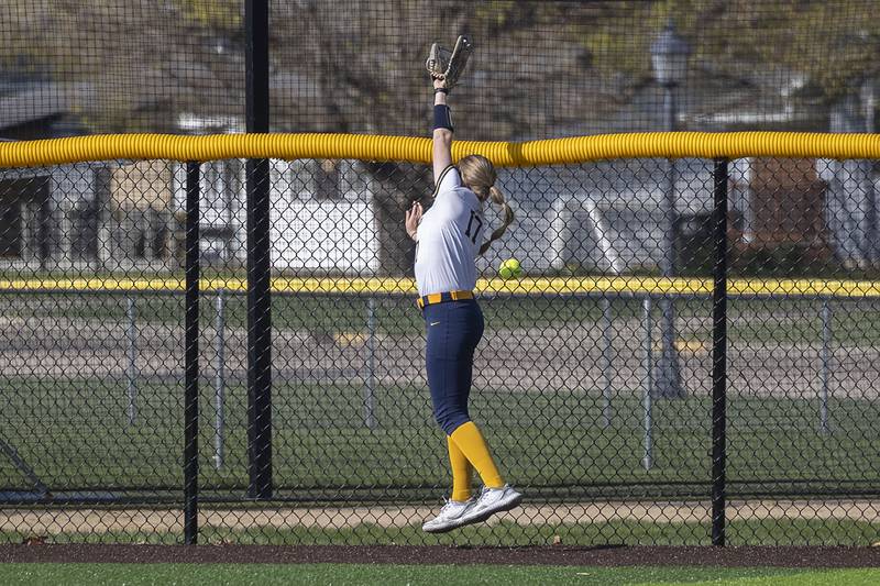 Sterling’s Lauren Jacobs reaches but is unable to snag a home run by Morrison’s Isabella Duncan Wednesday, April 26, 2023.