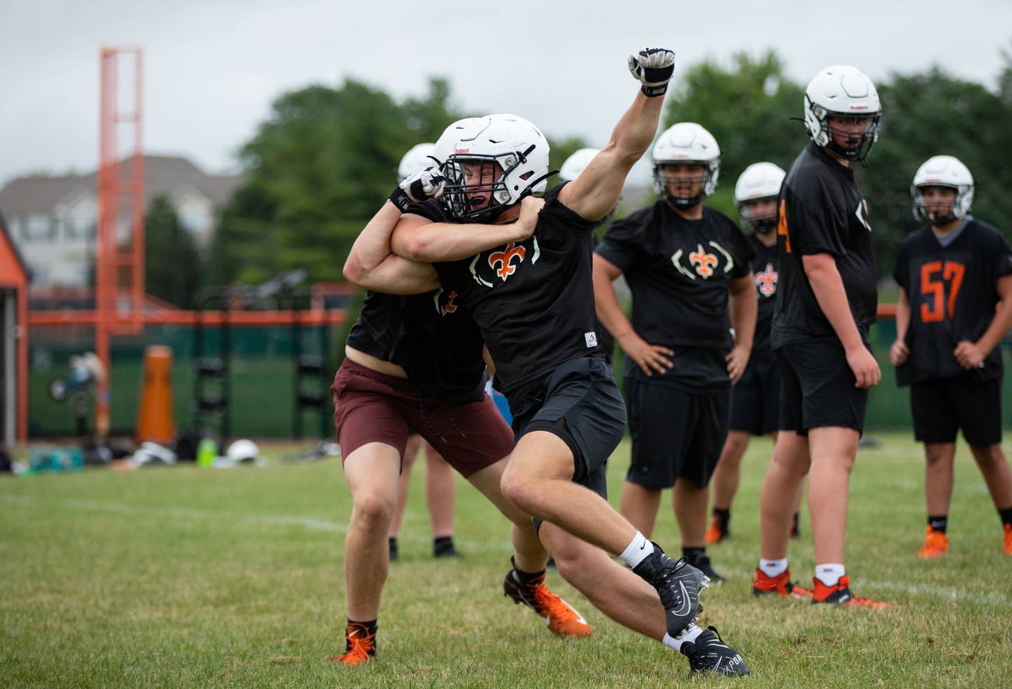 Left Tackle Austin Barrett runs a drill during practice at St. Charles East on Monday, Aug. 8, 2022.