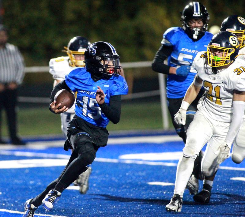 St. Francis quarterback Alex Taylor keeps the ball during a Class 5A first-round game against Sterling on Friday, Nov. 1, 2024 in Wheaton.