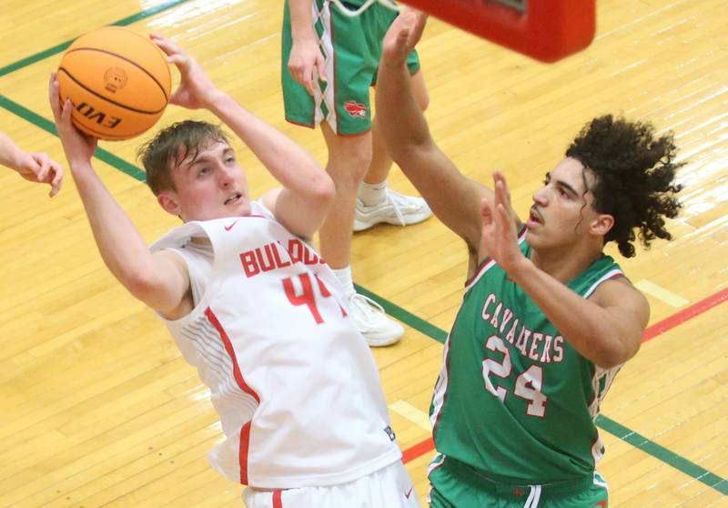 Streator's Nolan Lukach eyes the hoop as L-P's Marion Persich defends during the Class 3A Regional title game on Friday, Feb. 28, 2025 in Sellett Gymnasium at L-P High School.
