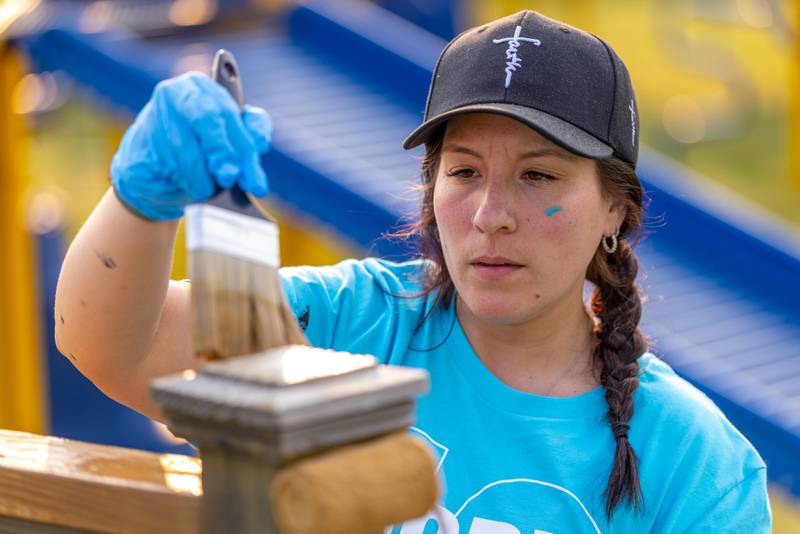 Kylie Moreno puts the finishing touches on a fence surrounding the playground at Rotary Park on June 1, 2025 in LaSalle.