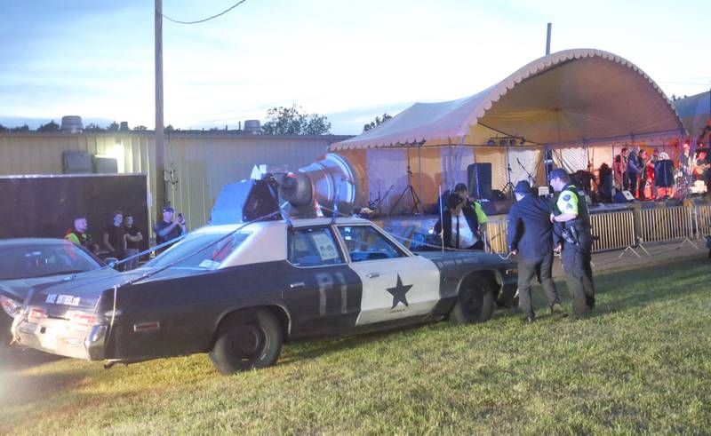 Oglesby Police officers perform a mock police arrest for the Blooze Brothers band members before entering the stage during the Summer Fun Fest on Friday, June 14, 2024 in Oglesby.